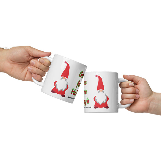 2 people holding a 20 oz white glossy mug with a gnome on it doing a cheers